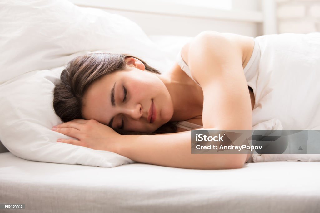Beautiful Woman Sleeping On Bed A Young Beautiful Woman Sleeping On Bed In Bedroom Sleeping Stock Photo