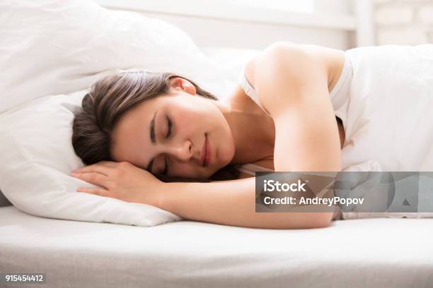 Beautiful Woman Sleeping On Bed Stock Photo - Download Image Now - Sleeping, Women, Bed - Furniture