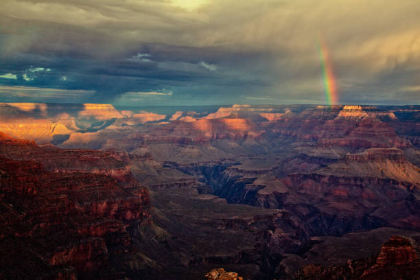 istock Grand Canyon landscape, rainbow and rain 915454654