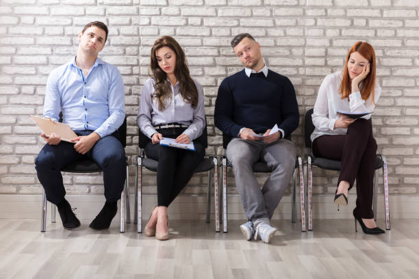 istock Boredom Applicants Waiting For Job Interview 915458048