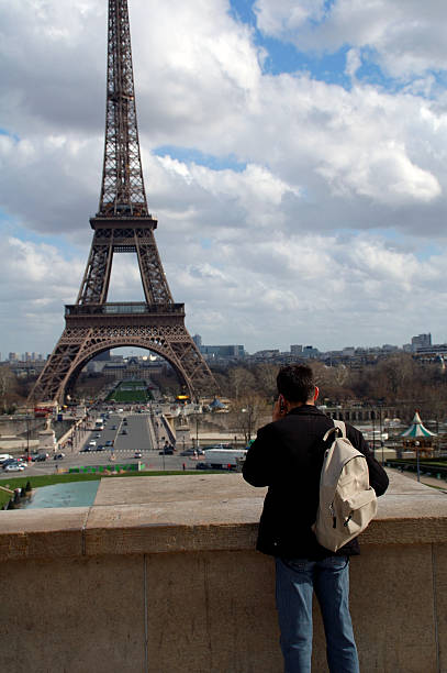 istock Eiffel Tower & Tourist on Cell Phone 91545864
