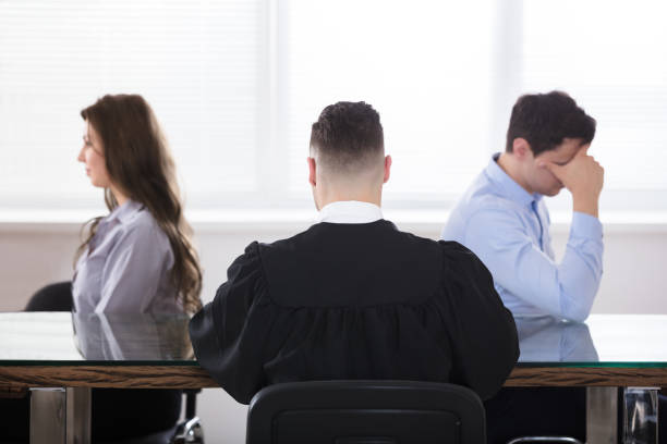 istock Judge Sitting With Displeased Couple 915460714