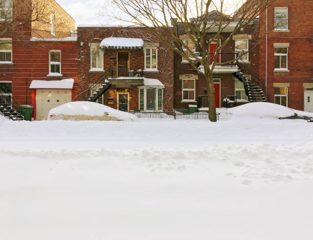Snowy urban street with brick buildings Snowy urban street with brick buildings. Space for text. Montreal, Quebec, Canada. duplex stock pictures, royalty-free photos & images
