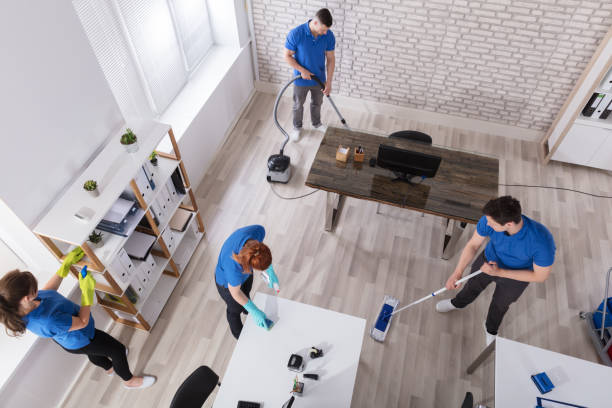 istock Group Of Janitors Cleaning The Office 915461280