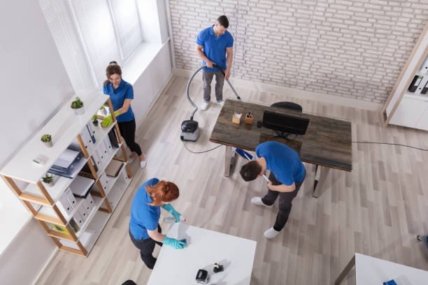 istock Group Of Janitors Cleaning The Office 915461310
