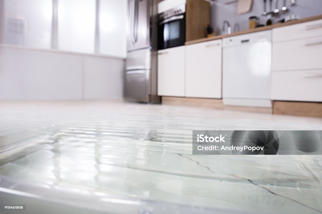 Close-up Of Wet Floor Close-up Photo Of Flooded Floor In Kitchen From Water Leak Flooring Stock Photo