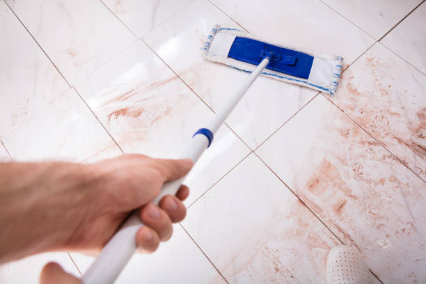 istock Person Holding Mop And Mopping Dirty Kitchen Floor 915461876