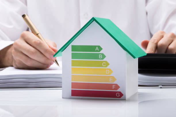 istock Businessman Calculating Energy Efficient House 915461916