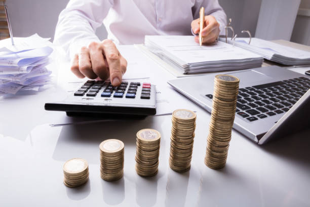 istock Businessman Calculating Tax Using Calculator 915462670