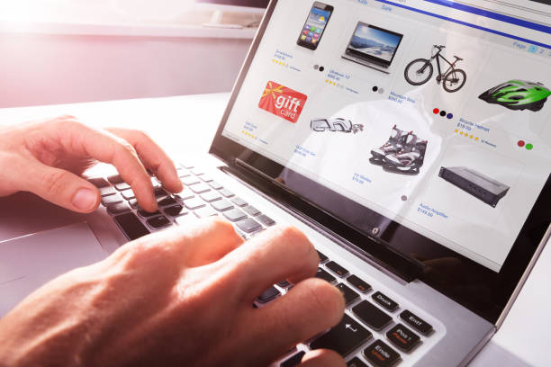 Person Shopping Online On Laptop Close-up Of Person Shopping Online On Laptop Over Desk net sports equipment stock pictures, royalty-free photos & images