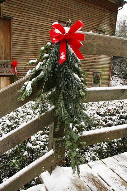 Christmas Greens With Bow On Fence - Youngstown, Ohio  youngstown stock pictures, royalty-free photos & images
