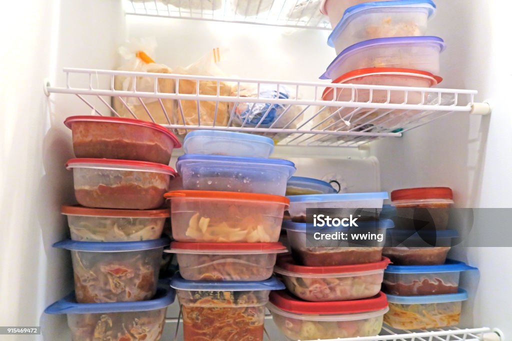 Food packaged and frozen inside a home freezer Leftovers Stock Photo