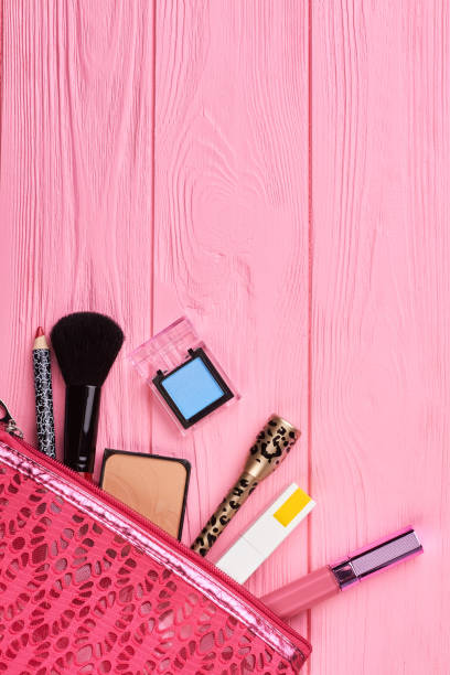 istock Cosmetics bag with makeup products, top view. 915470548