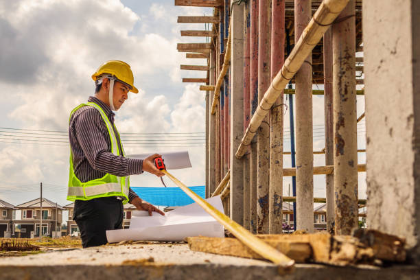istock Asian business man construction engineer worker at house building site 915482988