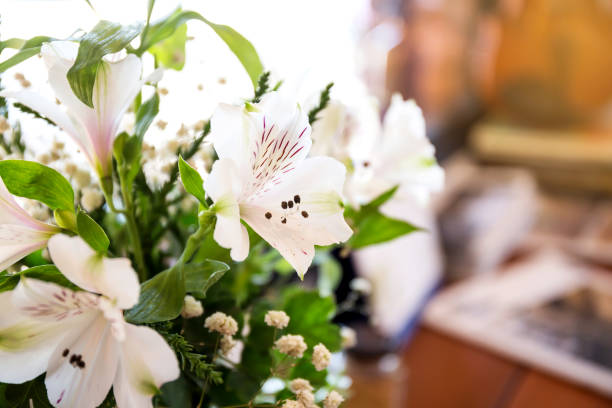 istock Artificial flower in the pot over wood table 915483292