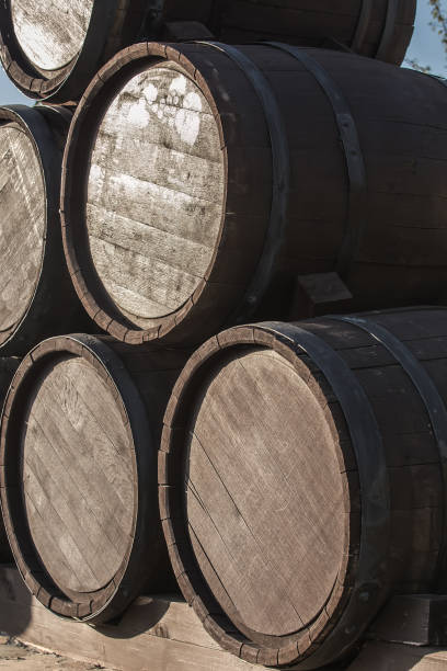 istock Wooden barrels in a pile. Closeup. 915486628