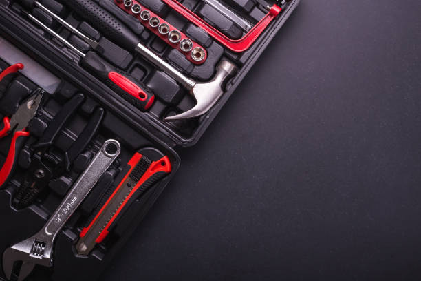 istock New square black tool box on black granite board background. Composition with free space for text or design 915494924