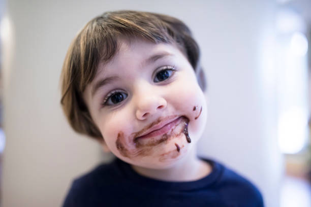 istock Little Boy Eating Chocolate 915504474