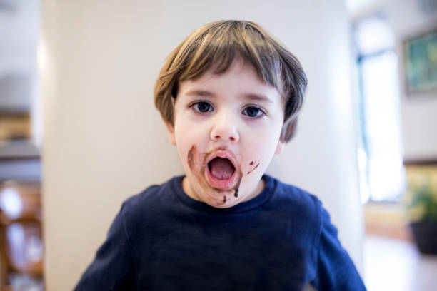 istock Little Boy Eating Chocolate 915506630