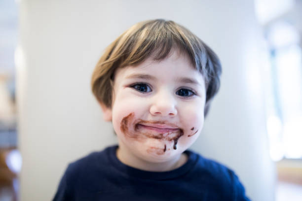 istock Little Boy Eating Chocolate 915506646