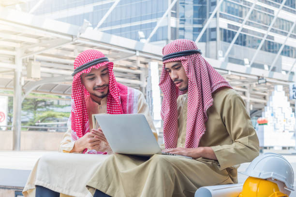 istock The arabian engineer talking about construction job with laptop 915518090