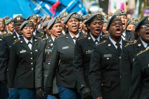 A group of high school junior ROTC cadets sound off while walking in the Georgia Veterans Day Parade, on November 11, 2017 in Atlanta, GA.