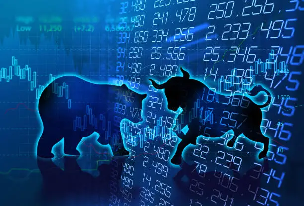 silhouette form of bull and bear on financial stock market graph represent stock market risk or random trend investment