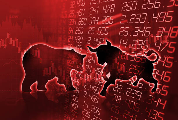 istock silhouette form of bull and bear on technical financial graph 915524146