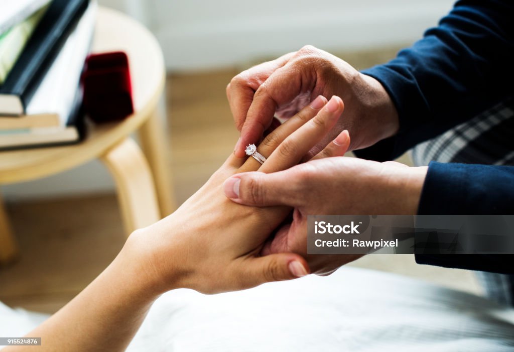 Man proposing to his girlfriend Engagement Stock Photo