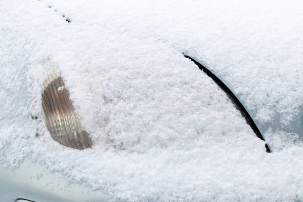 istock Front headlight covered by snow at winter time. 915531238