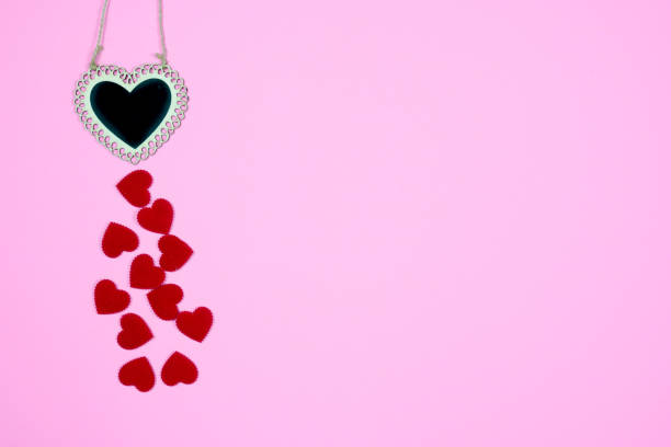 istock Love concept absract background with mini red heart on pink background included copyspace for add text or graphic 915531618