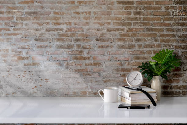 istock Workspace desk books, house plant, pencils and clock with copy space 915531782