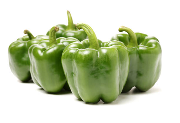istock Isolated green capsicum couple on white background 915543816