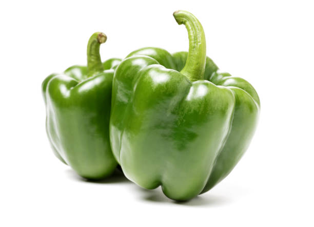 istock Isolated green capsicum couple on white background 915543894