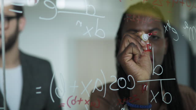Writing Mathematical Formulas On Glass Board