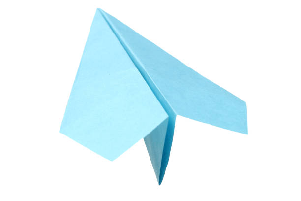 istock Paper airplane flying on white background 915544514