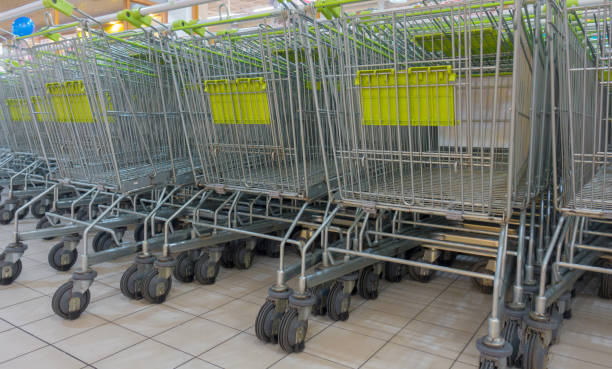 istock stack of shopping carts in a supermarket store 915547172