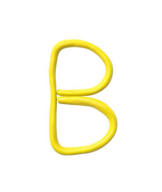 istock Closeup yellow plasticine for kid in B alphabet isolated on white background with clipping path 915549944