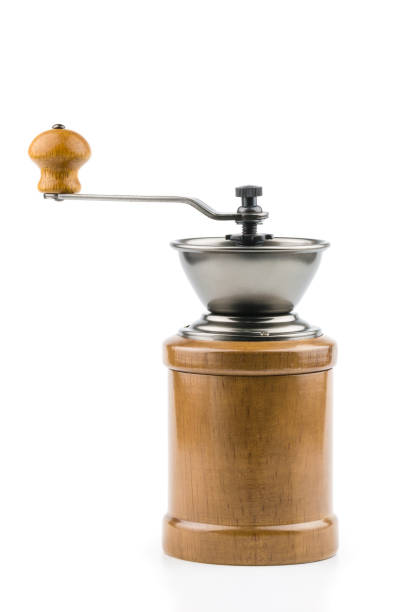 A vintage retro coffee grinder in a wooden case with handle isolated on white background (Old-fashioned).