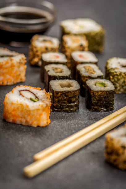 istock Sushi rolls hosomaki and uramaki 915563352