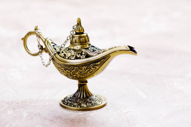 istock Aladdin magic lamp on the sand 915563836