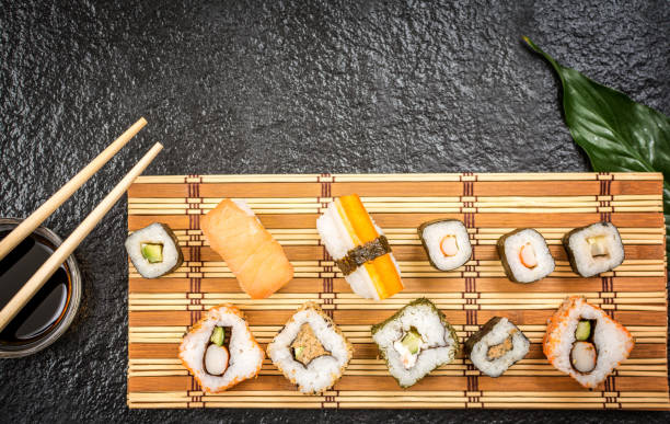 istock Sushi rolls hosomaki and uramaki 915564144