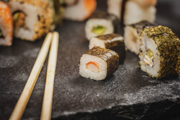 istock Sushi rolls hosomaki and uramaki 915567256