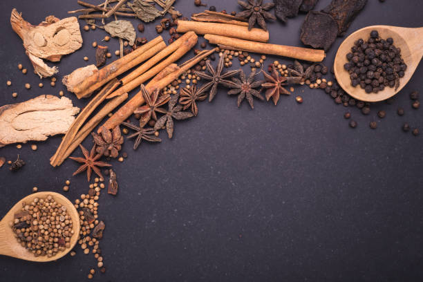 istock Mix of dried spices and herb on black stone table 915570330