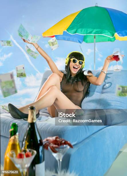 Woman Wearing Headphones On The Beach Stock Photo - Download Image Now - Beach, Currency, Summer