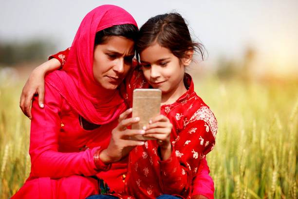 istock Mother And Daughter Using Smartphone 915582982