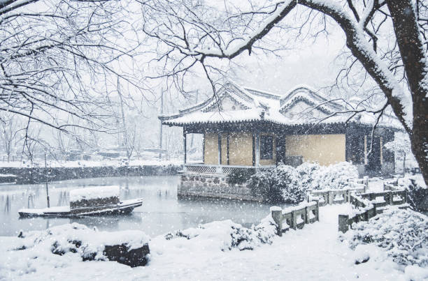 istock Snow-covered landscape in the park, China. 915585356