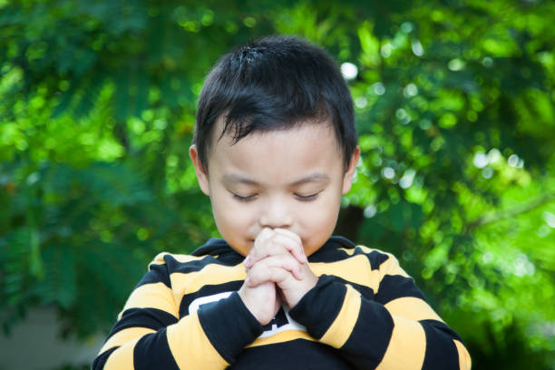 istock Children pray to God. 915585436