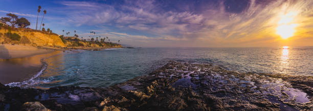 istock Diver's Cove Sunset Panorama 915594132
