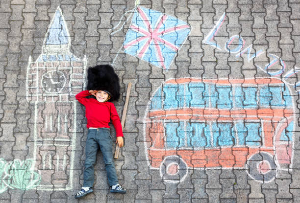 istock kid boy in british soldier uniform with London chalks picture 915600794